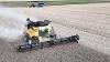 A aerial view of a New Holland Agriculture harvester in action.