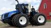 Graduating Lakeland College agricultural sciences students pose on a New Holland Agriculture tractor.
